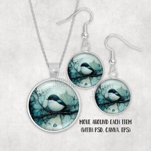 May include: A silver-toned jewellery set comprising a pendant necklace and drop earrings. Each piece features a circular setting with a watercolour illustration of a small bird on a branch. The bird has a white body and a dark blue head.