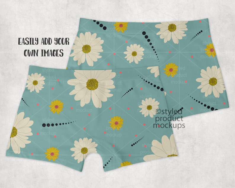 May include: Two pairs of blue boxer shorts with a white daisy and yellow flower pattern. The shorts have a black dotted line pattern. The text "EASILY ADD YOUR OWN IMAGES" is visible at the top of the image.