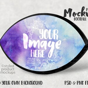 May include: A watercolor football plaque mockup with a black frame. The plaque has a purple and blue watercolor background with a white floral design. The text "Your Image Here" is written in white on the plaque.