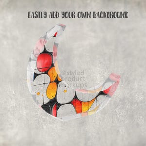May include: A crescent-shaped design with a colorful, abstract pattern of red, orange, yellow, and white shapes. The design is set against a textured gray background. Text at the top reads "EASILY ADD YOUR OWN BACKGROUND".