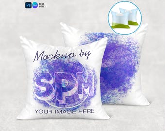 May include: Two white square cushions with a purple and blue design. The text "Mockup by SPM" and "YOUR IMAGE HERE" are printed on the front cushion. A small graphic of two cushions is in the upper right corner.