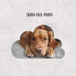 May include: A golden-brown dog resting on a gray cloud-shaped dog bed. The dog is looking directly at the viewer. The text "SHOW FULL PRINT" is above the dog. The image is a product mockup.