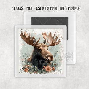Puede incluir: Una impresi&oacute;n de estilo acuarela de un alce con grandes astas, rodeado de flores y vegetaci&oacute;n, en un marco blanco. El texto "AI WAS -NOT- USED TO MAKE THIS MOCKUP" est&aacute; en la parte superior.