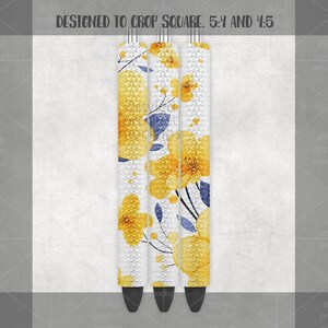 May include: Three pens with a floral design. The pens have a white background with yellow flowers and blue accents. The text "DESIGNED TO CROP SQUARE. 5:4 AND 4:5" is at the top.