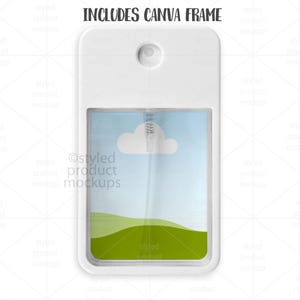 May include: A white rectangular pocket-sized spray bottle with a clear window displaying a sky and cloud scene over a green landscape. The text "INCLUDES CANVA FRAME" is at the top.