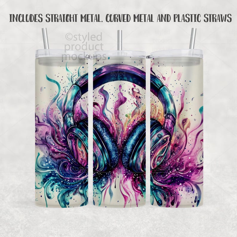 May include: A white tumbler with a colorful watercolor design featuring headphones. The design incorporates shades of blue, purple, and pink. The tumbler includes a lid and a straw. Text at the top reads: INCLUDES STRAIGHT METAL, CURVED METAL AND PLASTIC STRAWS.