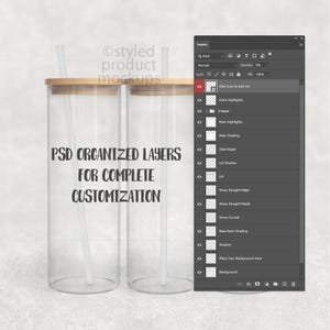 May include: Two clear glass tumblers with bamboo lids and straws. The text "PSD ORGANIZED LAYERS FOR COMPLETE CUSTOMIZATION" is printed on the front. A digital interface shows layers for customization.