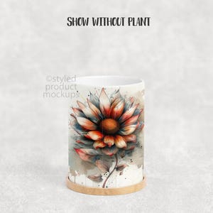 May include: A white ceramic mug with a watercolor floral design featuring a large orange, red, and white flower. The mug sits on a small, round wooden coaster. The text "SHOW WITHOUT PLANT" is at the top.