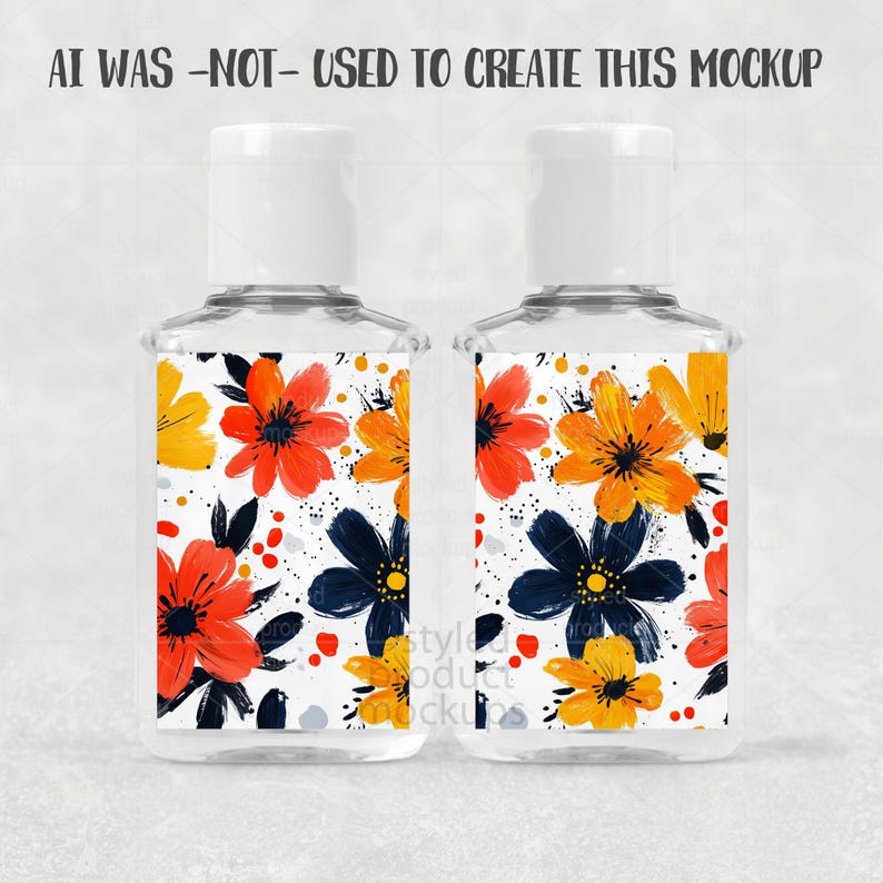 May include: Two clear hand sanitizer bottles with white caps. Each bottle has a label with a floral design featuring orange, yellow, and navy blue flowers on a white background. The text "AI WAS -NOT- USED TO CREATE THIS MOCKUP" is at the top.