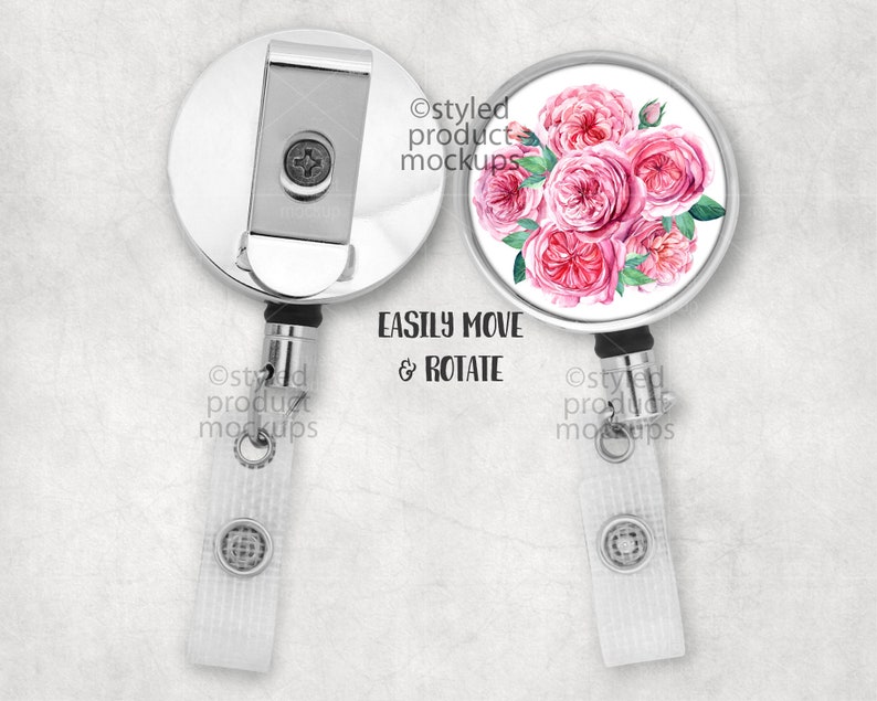 May include: A silver retractable badge holder with a white background and a pink watercolor floral design. The design features a bouquet of pink roses with green leaves. The text "EASILY MOVE & ROTATE" is printed in black below the design.