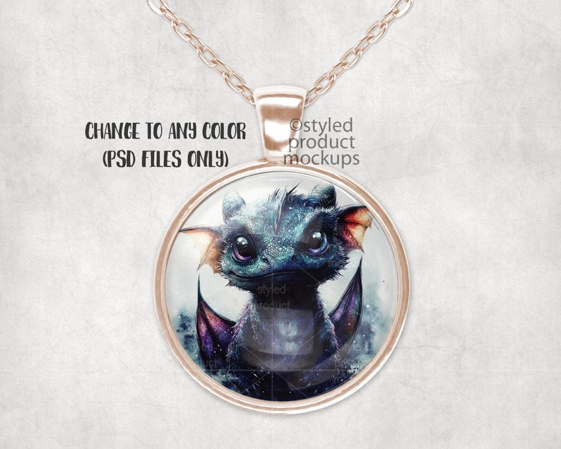May include: A necklace with a round glass pendant featuring a blue and purple dragon illustration. The pendant is attached to a rose gold chain.