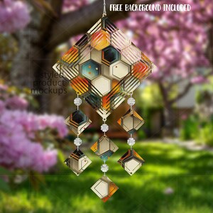 May include: Geometric wind chime with a diamond-shaped top and hanging diamond-shaped accents. The top features a honeycomb design with orange, yellow, black, and white colours. The text "FREE BACKGROUND INCLUDED" is at the top.
