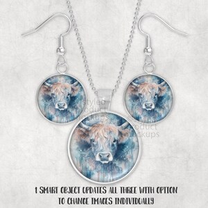 May include: A silver necklace and earring set. Each piece has a circular pendant with a watercolour image of a Highland cow. The cow has brown fur and blue accents. The text at the bottom reads "1 SMART OBJECT UPDATES ALL THREE WITH OPTION TO CHANGE IMAGES INDIVIDUALLY."