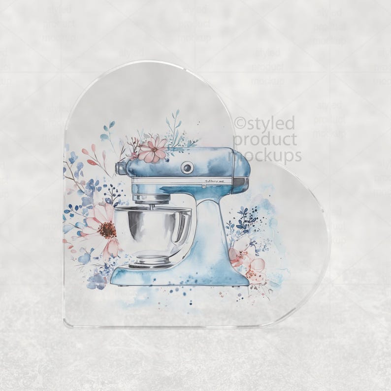 May include: A light blue stand mixer illustration with a silver mixing bowl, adorned with watercolor floral accents in pink and blue. The design is set against a soft, neutral background, evoking a sense of vintage charm and culinary artistry.