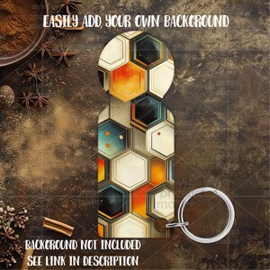 May include: A key chain with a geometric design of hexagons in orange, cream, and teal. The key chain has a silver-colored ring. The text "EASILY ADD YOUR OWN BACKGROUND" and "BACKGROUND NOT INCLUDED SEE LINK IN DESCRIPTION" are visible.