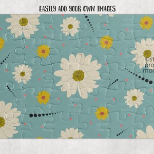 May include: A blue jigsaw puzzle with a white daisy pattern. The puzzle pieces are arranged in a random pattern. The text "EASILY ADD YOUR OWN IMAGES" is at the top of the puzzle.