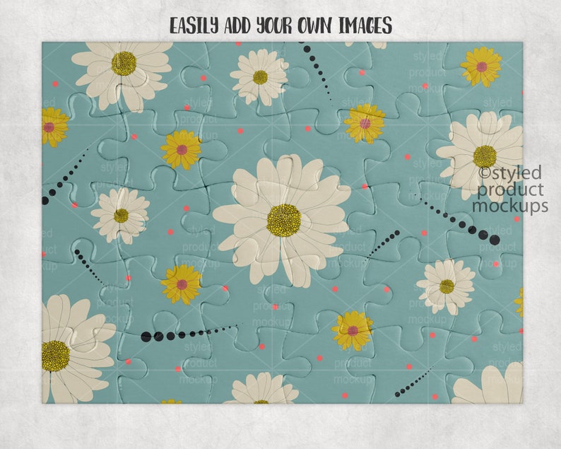 May include: A blue jigsaw puzzle with a white daisy pattern. The puzzle pieces are arranged in a random pattern. The text "EASILY ADD YOUR OWN IMAGES" is at the top of the puzzle.