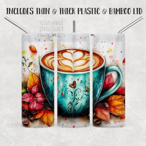 May include: A tumbler with a watercolor design featuring a coffee cup with latte art, butterflies, and autumn leaves. The tumbler has a thin and thick plastic and bamboo lid. The text at the top says, "INCLUDES THIN & THICK PLASTIC & BAMBOO LID."