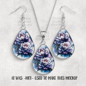May include: A jewelry set featuring a pendant necklace and matching earrings. Each piece has a teardrop shape with a floral design in shades of purple, white, and blue. The text "AI WAS -NOT- USED TO MAKE THIS MOCKUP" is at the bottom.