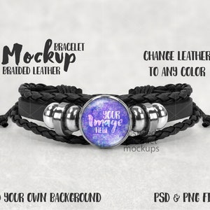 May include: Black braided leather bracelet with a silver metal bead and a round, purple and blue, glass charm with the text "YOUR Image HERE".