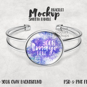 Könnte beinhalten: Silberarmband mit einem runden, klaren Glasanhänger. Der Anhänger hat einen lila und blauen Aquarellhintergrund mit dem Text "YOUR IMAGE HERE" in rosa und weiß.