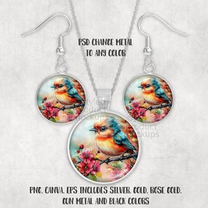 May include: A silver-toned jewellery set comprising a pendant necklace and earrings. Each piece showcases a watercolour image of a colourful bird on a flowering branch within a round frame. The image text reads "PSD CHANGE METAL TO ANY COLOR".