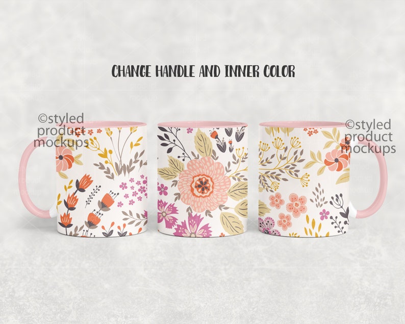 May include: Three white ceramic mugs with pink handles and rims. Each mug features a different floral pattern in shades of pink, orange, yellow, and green. The text "Styled product mockups" appears on the left and right sides of the image.