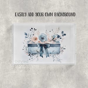 May include: A clear acrylic tray with a watercolor design. The design features a blue box with a bow, surrounded by blue and peach flowers and foliage. The text "EASILY ADD YOUR OWN BACKGROUND" is at the top.