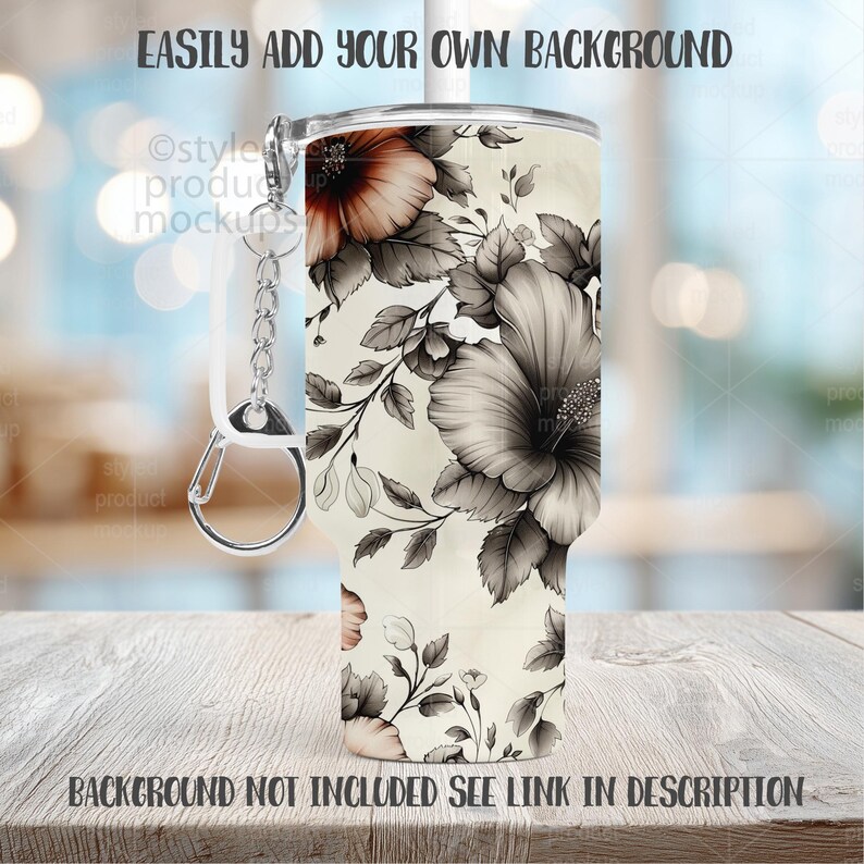 May include: A white tumbler with a floral design in shades of gray and peach. The tumbler has a silver keychain attached. The text "EASILY ADD YOUR OWN BACKGROUND" and "BACKGROUND NOT INCLUDED SEE LINK IN DESCRIPTION" are visible.