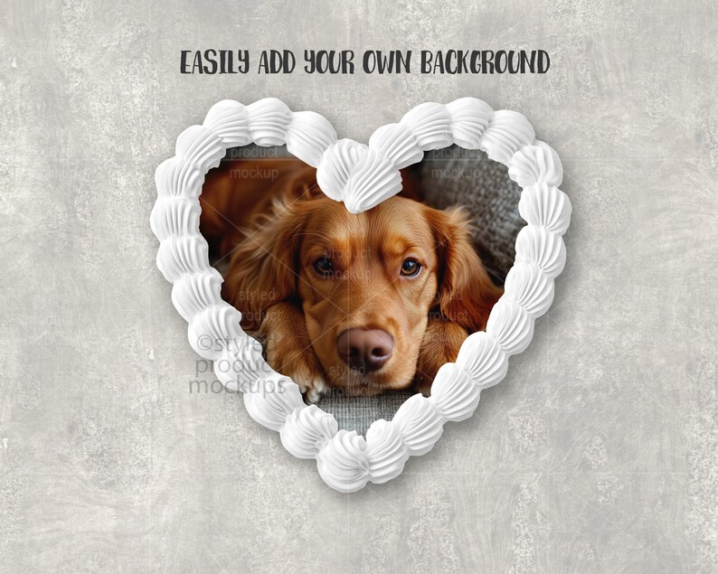 May include: A heart-shaped frame made of white frosting surrounds a golden-brown dog. The dog is lying down, looking directly at the viewer. The background is a textured gray surface. Text at the top reads "EASILY ADD YOUR OWN BACKGROUND".