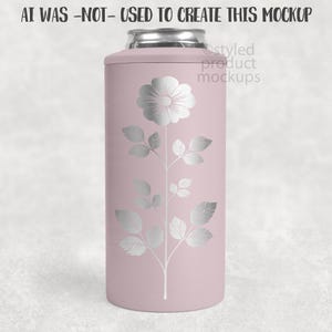 May include: A pink can cooler with a silver floral design. The design features a large flower at the top and a stem with leaves that runs down the length of the cooler. The text "AI WAS -NOT- USED TO CREATE THIS MOCKUP" is at the top.