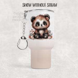 May include: A white and tan tumbler featuring a watercolor illustration of a cute panda bear with a flower on its head. The tumbler has a silver keychain and the text "SHOW WITHOUT STRAW" at the top.
