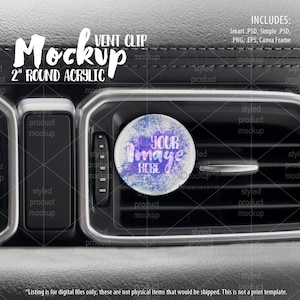 May include: A mockup of a 2 inch round acrylic car vent clip. The clip is shown in a car's air vent with a colorful design that says "Your Image Here".