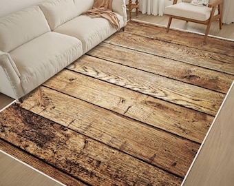 May include: A rectangular area rug featuring a high-resolution print of weathered brown wooden planks with visible grain patterns and knots. The rug is positioned on a light-colored floor, extending underneath a cream-colored sofa and a wooden chair.
