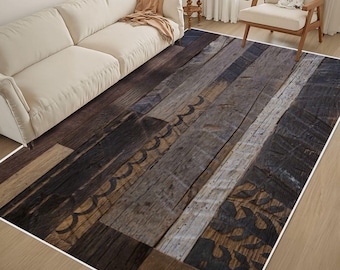 May include: A rectangular area rug featuring a printed design of weathered wooden planks in various shades of brown, gray, and black. The pattern includes dark, rustic wood grain textures and decorative black scrollwork and leaf motifs.