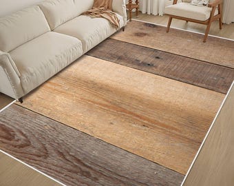 May include: A rectangular area rug featuring a printed pattern of wide, horizontal wooden planks in varying shades of brown, tan, and gray. The design mimics the appearance of weathered timber with visible wood grain and knots.