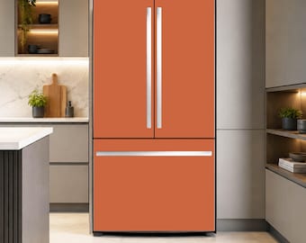 May include: A matte burnt orange French door refrigerator featuring two vertical silver handles on the upper doors and one horizontal silver handle on the bottom freezer drawer, set within a modern kitchen cabinetry environment.