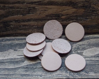Ten light brown leather discs 26mm Diameter