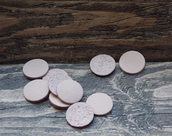 Bag of ten light brown leather discs 20mm Diameter