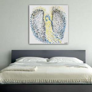 May include: Abstract painting of an angel with blue and yellow paint splatter on a white background.