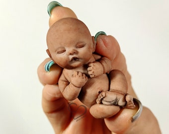 Solid silicone miniature Ethnic sleeping baby Simon(e) 5,7cm (2.24") with bent legs