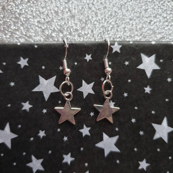 Tiny silver star earrings on sterling silver hooks