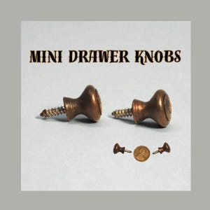 May include: Two antique-style mini drawer knobs with a bronze finish, each with a screw for installation. The image also shows a penny for size comparison, along with two additional knobs. The text "MINI DRAWER KNOBS" is displayed at the top.