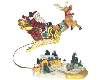 Table Top Flying Santa with Reindeer and His Sleigh Hand Painted Resin Figurine