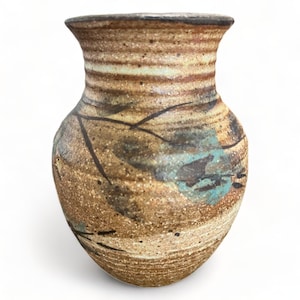 May include: A small, brown ceramic vase with a wide mouth and a narrow neck. The vase is decorated with a light brown glaze and has a blue and brown abstract design.