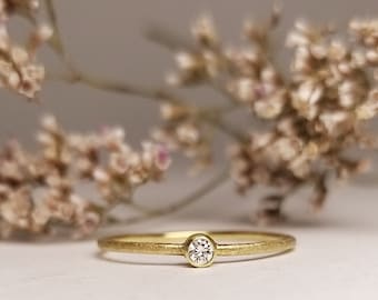 delicate simple engagement ring gold with diamond