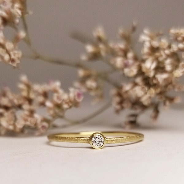 delicate simple engagement ring gold with diamond