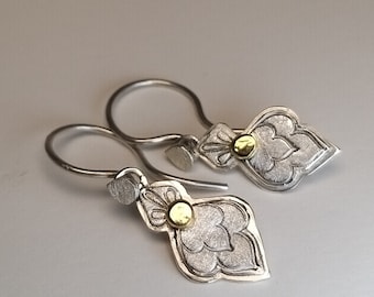 summery ornamental earrings in silver and gold