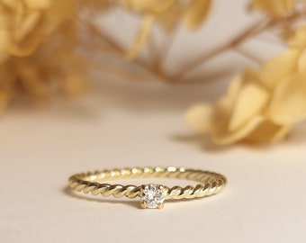 romantic engagement ring diamond cord ring yellow gold