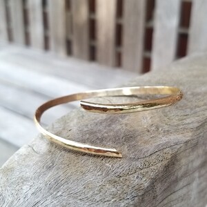 A3 open, curved bangle - forged in solid gold - light hammer blow, handmade